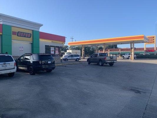 Cars in the parking lot and gas station of CEFCO.