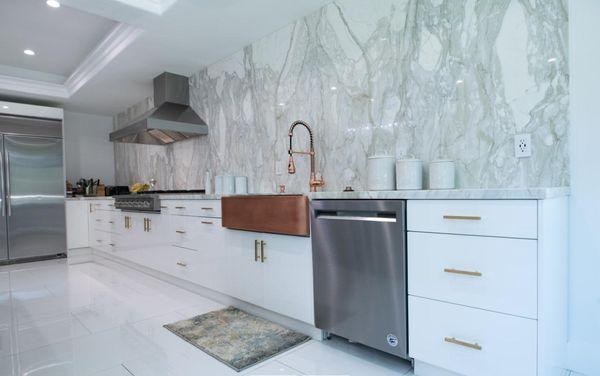 Modern, yet semi-farmhouse kitchen combining elements like stone, steel, and wood to bring to life a renovated home