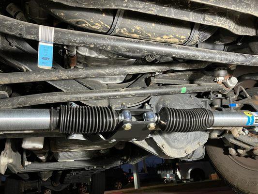 the new steering system, is why the original steering damper was to be removed