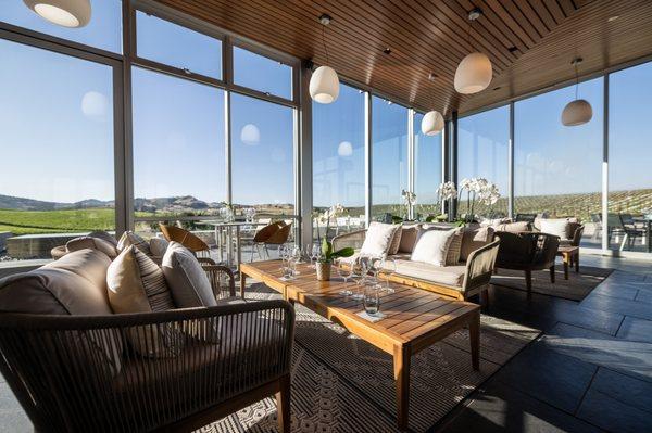 Interior of our scenic, Los Carneros tasting room with panoramic vineyard views