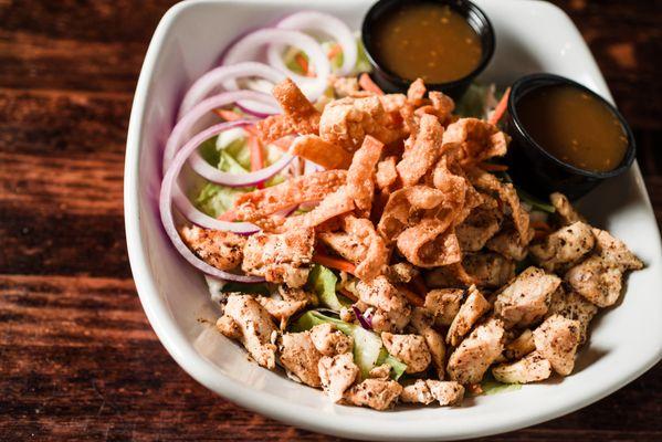 Crunchy Zen Salad - Fresh greens, cabbage, carrots, red onion, crispy wonton strips with Asian Sesame Dressing. Grilled chicken added.