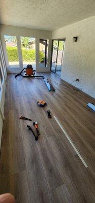 New Luxury Vinyl Plank (LVP) flooring installed in sunroom for a fix/flip house in the San Carlos area.