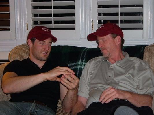 A pic of my son and me in our Stanford Graduate School of Business baseball caps, doing card tricks!