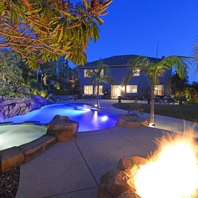 This resort backyard is packed with everything needed for the best summer ever including a saltwater Pebble-Tec pool