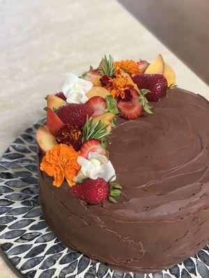 Triple Chocolate Ganache Cake with Edible Flowers and Seasonal Fruit