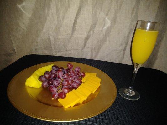 She serves mimosas and a fruit & cheese plate!