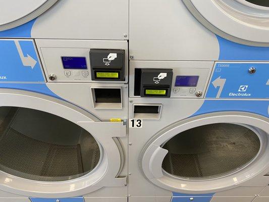 Large dryer on the left regular dryer to the right with prices on the card slot