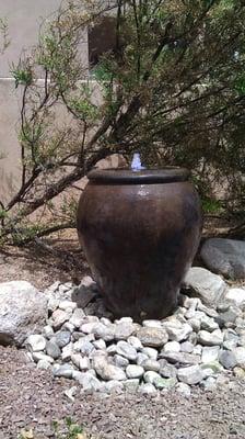 Pond-less, low maintenance urn fountain with a cobalt blue  led blubber