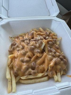 Chili cheese fries, cheese sauce, chili powder and some beans....