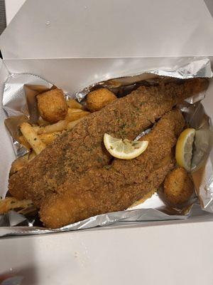 Fish basket with fries and hush puppies