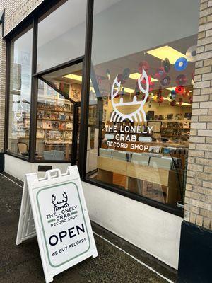 Lonely crab record shop storefront and open sign