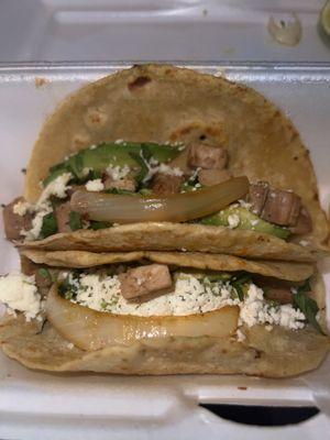 Chicken tacos with avocado and queso fresco