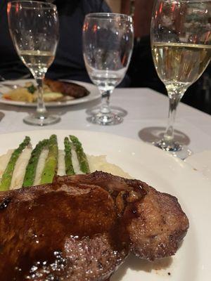 New York steak with whipped mashed potatoes and grilled asparagus