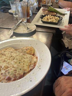 Ravioli and pork chop with asparagus and Mac n cheese