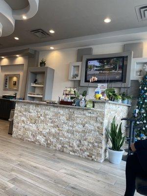 Salon front desk with nail colors displayed