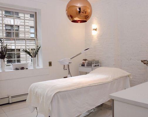 Take a look at our first treatment room with inviting views of the city.