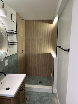 Our customer wanted light in the shower so we added LED Lights.