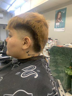 Burst Haircut with a Rattail Style