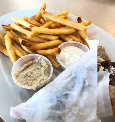 Gyro $10 Beef-lamb gyro meet sliced over a bed of salad mix and wrapped in a pita bread, served with tzatziki sauce, hummus and fries.