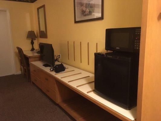 Desk, TV, microwave, fridge