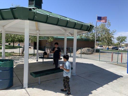 Nice sitting area between the two playgrounds to sit and watch your kids play. The restroom is conveniently nearby in the background.