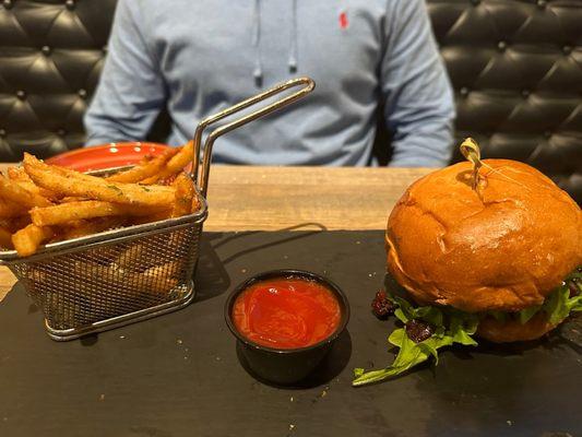 BLTG - candied bacon pieces, housemade tomato jam, arugula, goat cheese served on a buttered brioche bun (with truffle fries)