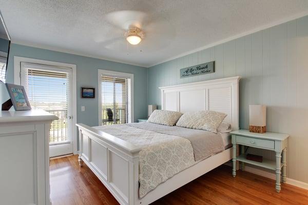 Master bedroom has a balcony overlooking a lagoon.