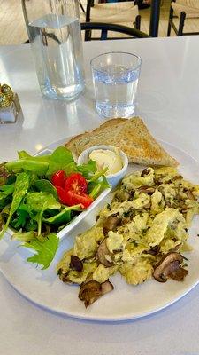 Mushroom scramble with side salad and sourdough toast