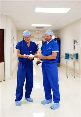 Dr. Scott Bowen confers with a colleague at Arkansas Surgical Hospital.