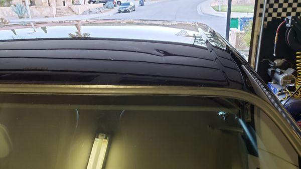 Dent in roof from hood.