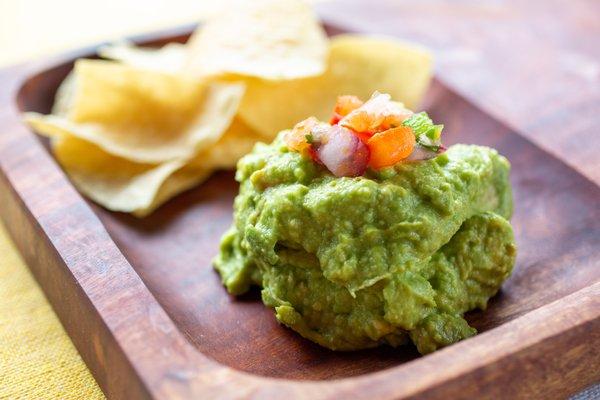 Guacamole, made fresh daily, with house chips.