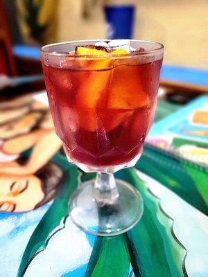 A glass of sangria. Fruity and sweet with a  modest red wine flavor.