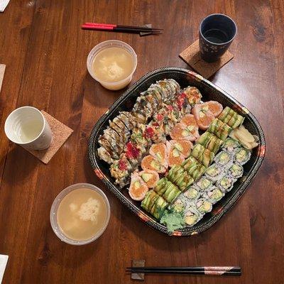 Miso soup and Rolls Lover for Three.  Godzilla rolls, cream crab, California roll, dragon rolls and a spicy girl roll.