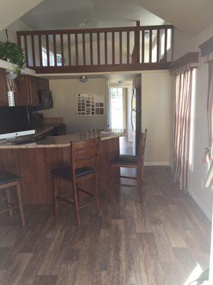 There are stairs that lead to a loft that overlooks the living area!