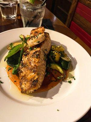 Scottish salmon with white shrimp, Romesco sauce, and roasted vegetables.