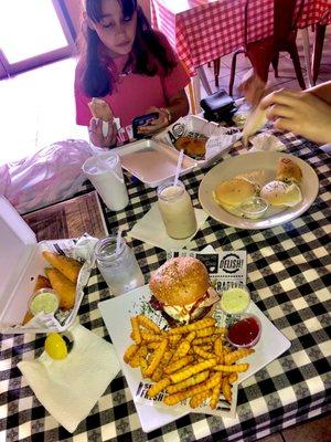 Burger, Empanadas de Queso, Carne y Pollo (Cheese, Beef and Chicken.) plus Arepas de queso.