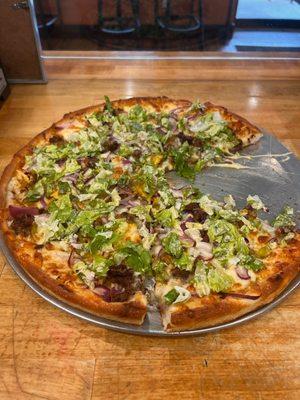 "Big Mac" Pizza: Burger, Pickles, Onions, Thousand Island made in-house, garnished with Lettuce