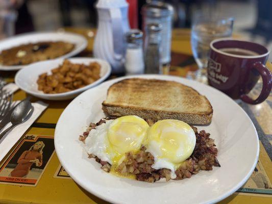 Corned beef hash, poached eggs, toast, Hollandaise sauce