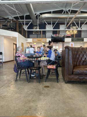 A family enjoying lunch in the common area of The Landing.