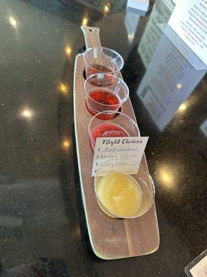 $15 flight. Peach slushy, Blueberry/blackberry slushy, hard cherry cider, and sangria.