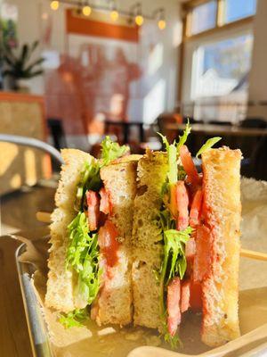 Thick Slab Bacon BLT (Bacon from Peterson Farms), with Revol Greens, Tomato Jam, on buttered toasted Multigrain Bread.