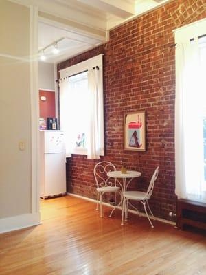 Exposed brick walls and tall ceilings. How much better can these apartments get?