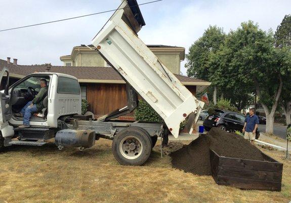 The Rockery driver offered to pull the truck into the yard to fill the new planter box, rather than dump it all in the driveway which saved