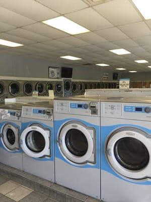 Washers are in the center and dryers line the wall