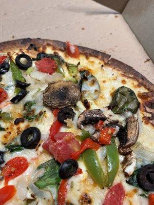 Burnt thin crust veggie pizza