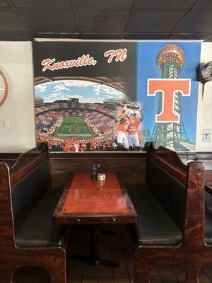 Booth with Knoxville wall art