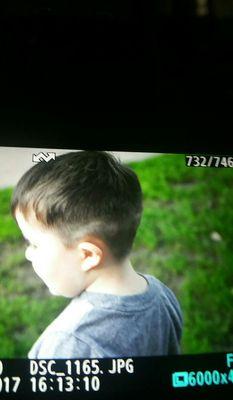 He is a mellow kid and we have NEVER had a problem getting his hair cut. The lady was too rough with him.