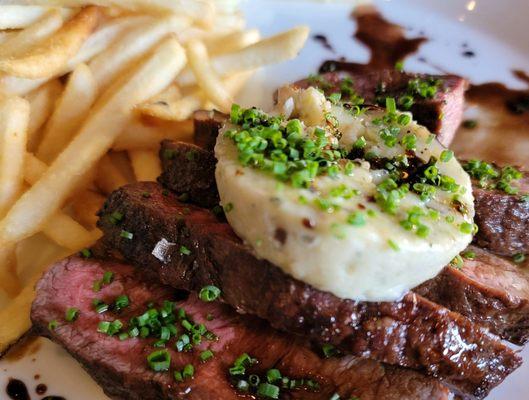 Steak with blue butter melt and fries. Perfectly cooked.