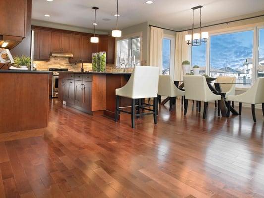 open floor plan where the maple brings warmth to the kitchen.