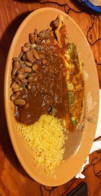 Plate one of the fiesta dinner, rice, beans, Chile relleno, tamale, enchilada